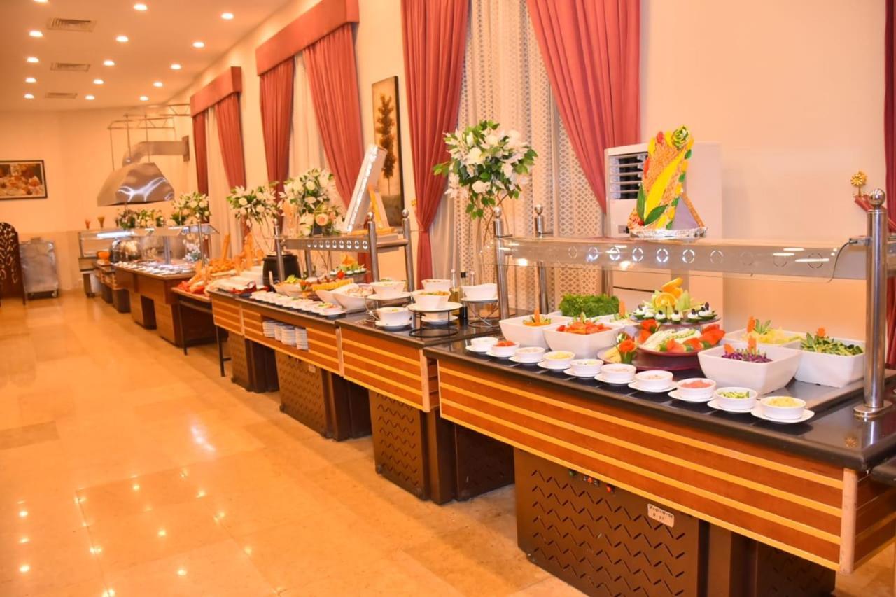 Jewel Sport City And Aqua Park Cairo Exterior photo A buffet at a hotel