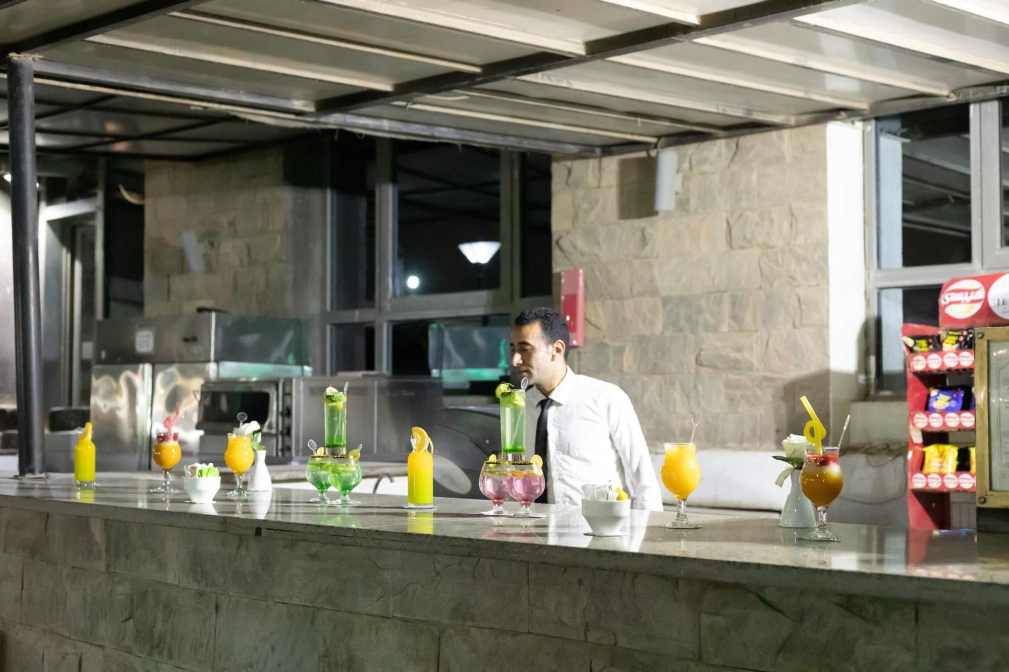 Jewel Sport City And Aqua Park Cairo Exterior photo A bartender at work